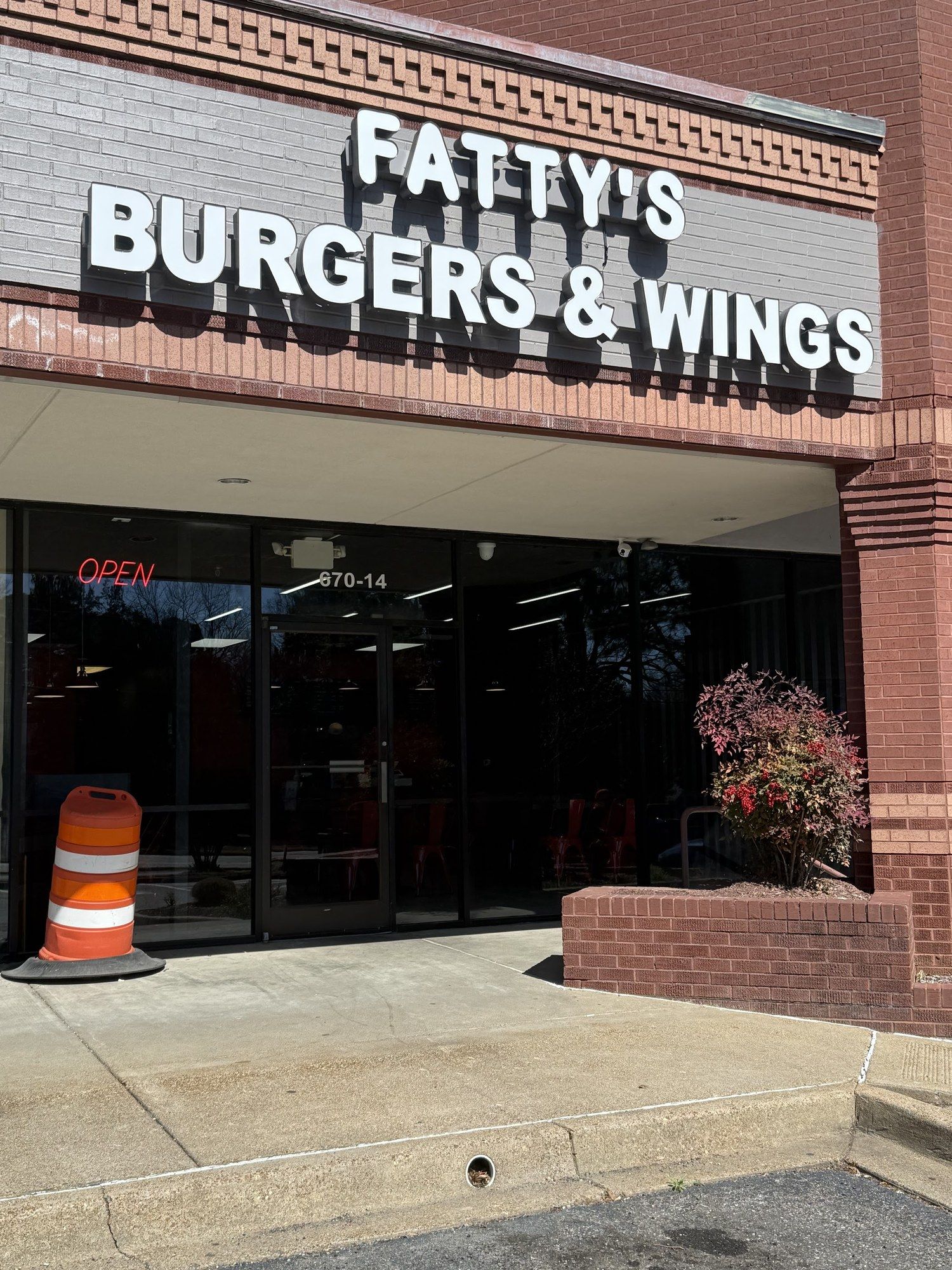 Fatty's Burgers & Wings storefront at 670 N Germantown Pkwy #14, with big white letters over the glass door